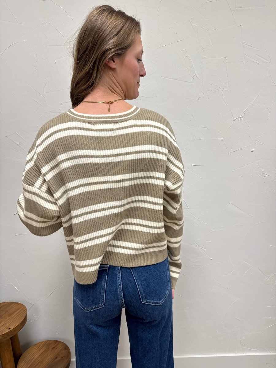 Back view of model wearing striped sweater with relaxed silhouette — Three:Twelve Boutique
