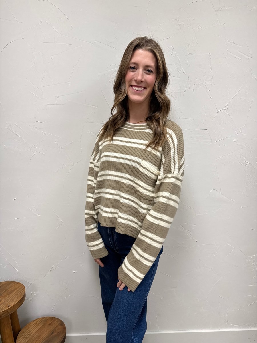 Lifestyle shot of model wearing striped sweater styled casually — Three:Twelve Boutique