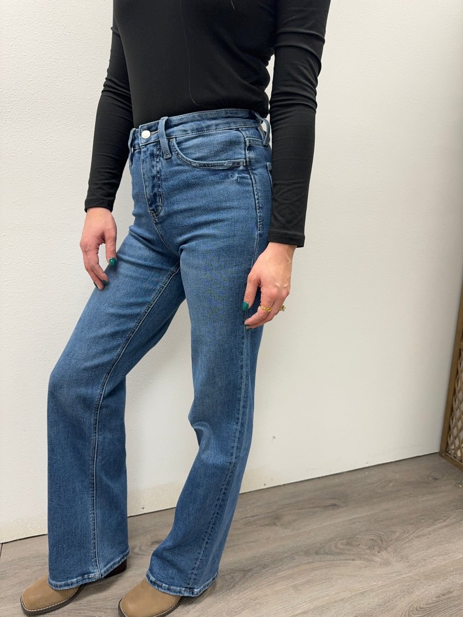 Side view of super high rise jeans showing wide leg fit and high waist — Three:Twelve Boutique