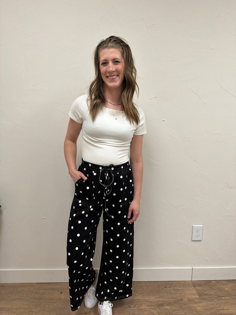 Lifestyle shot of model wearing The Breanna Top with casual denim styling — Three:Twelve Boutique