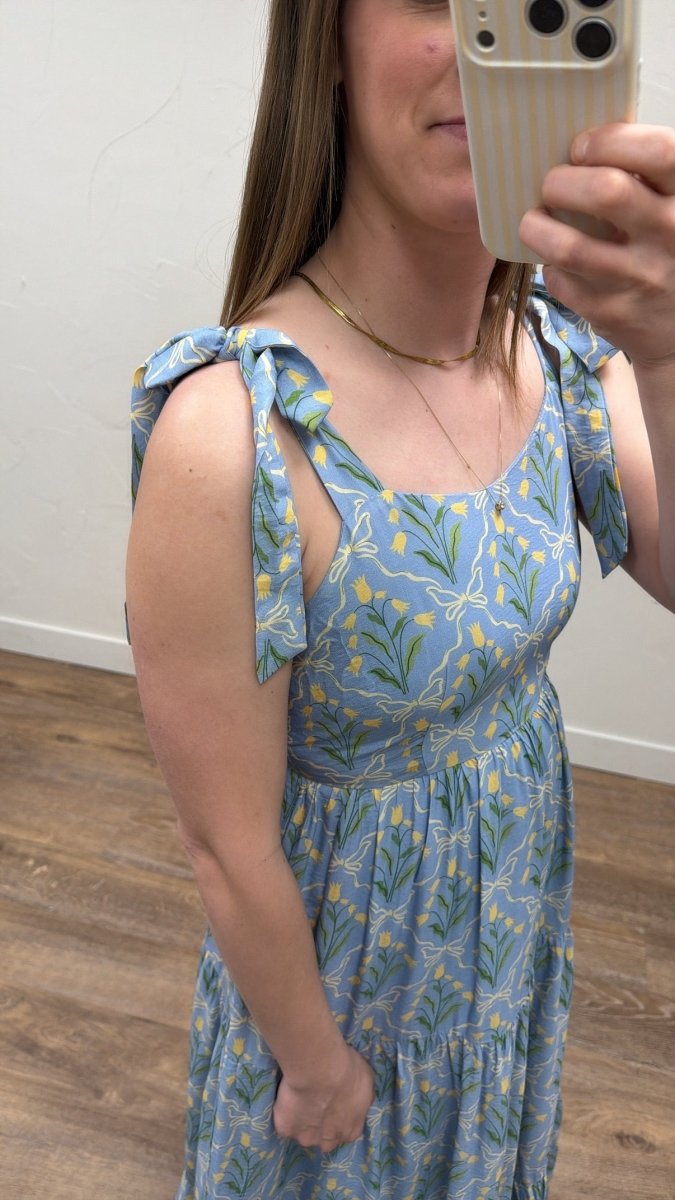 Side view of model wearing The Francine Dress showing drape and length — Three Boutique