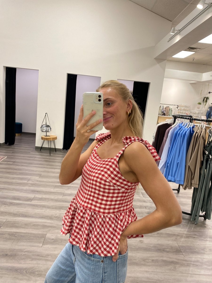 Lifestyle shot of model wearing red tank top styled with casual outfit — Three:Twelve Boutique