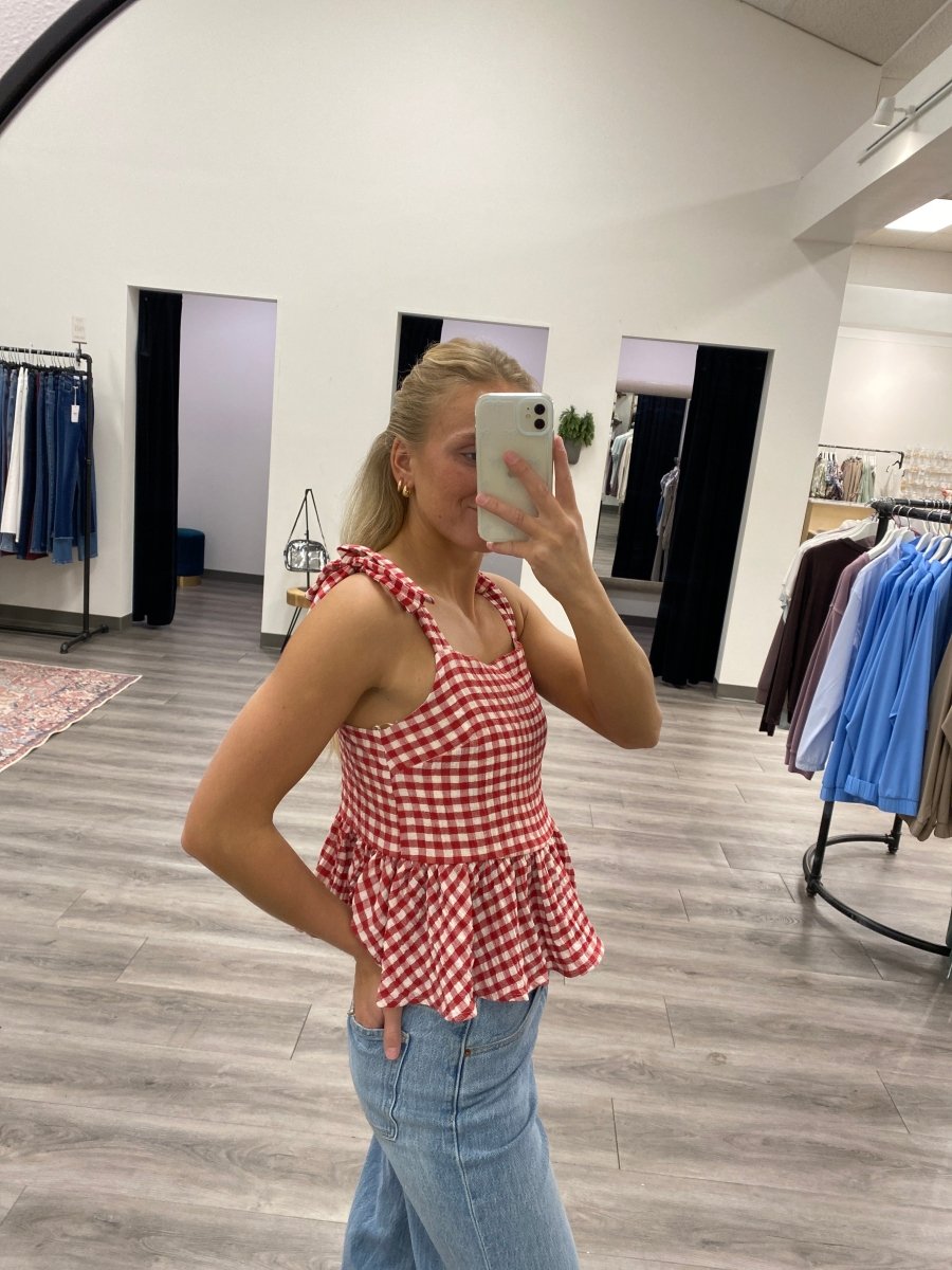 Lifestyle shot of model wearing red tank top styled with casual outfit — Three:Twelve Boutique
