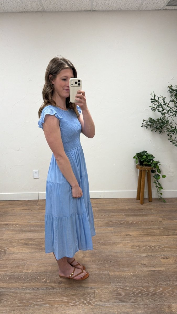 Side view of tiered midi dress showing flowy skirt layers — Three:Twelve Boutique