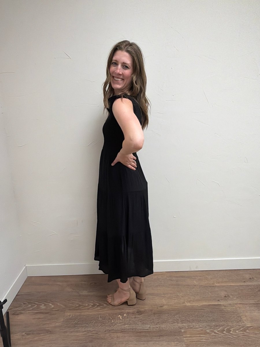 Side view of model wearing Tiered Smocked Short Sleeve Midi Dress for Women