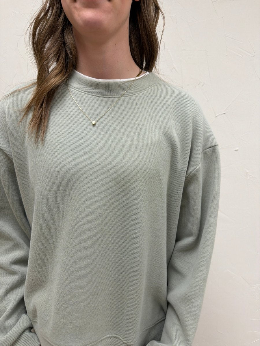 Close up of faux layered sweatshirt fabric and neckline detail — Three:Twelve Boutique