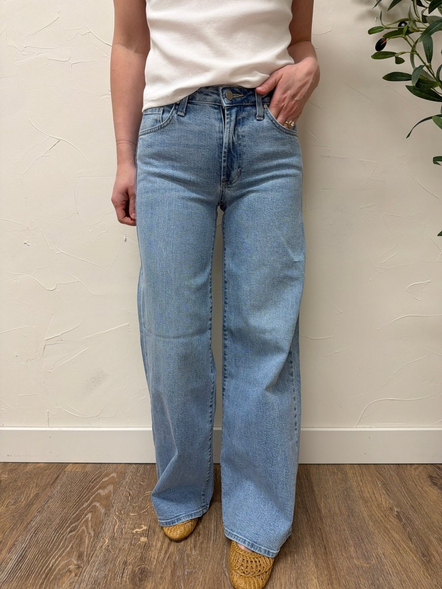 Lifestyle shot of model wearing Ultra Wide denim jeans styled with casual top — Three:Twelve Boutique