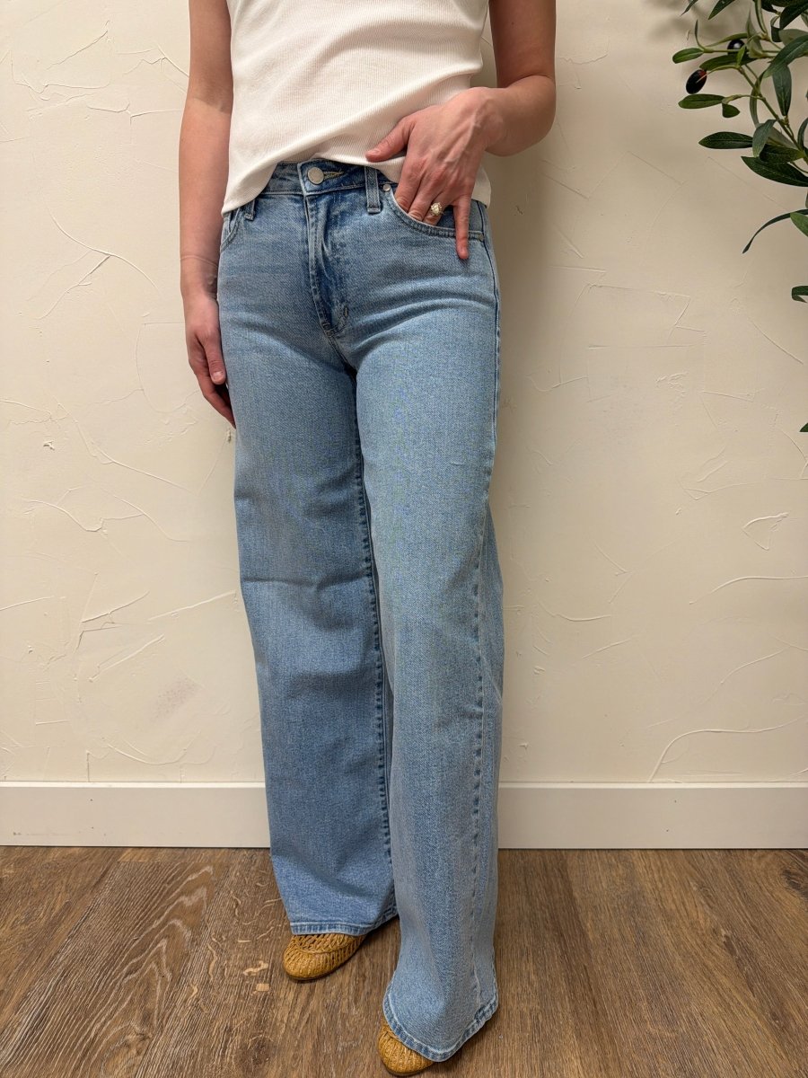 Lifestyle shot of model wearing Ultra Wide denim jeans styled with casual top — Three:Twelve Boutique