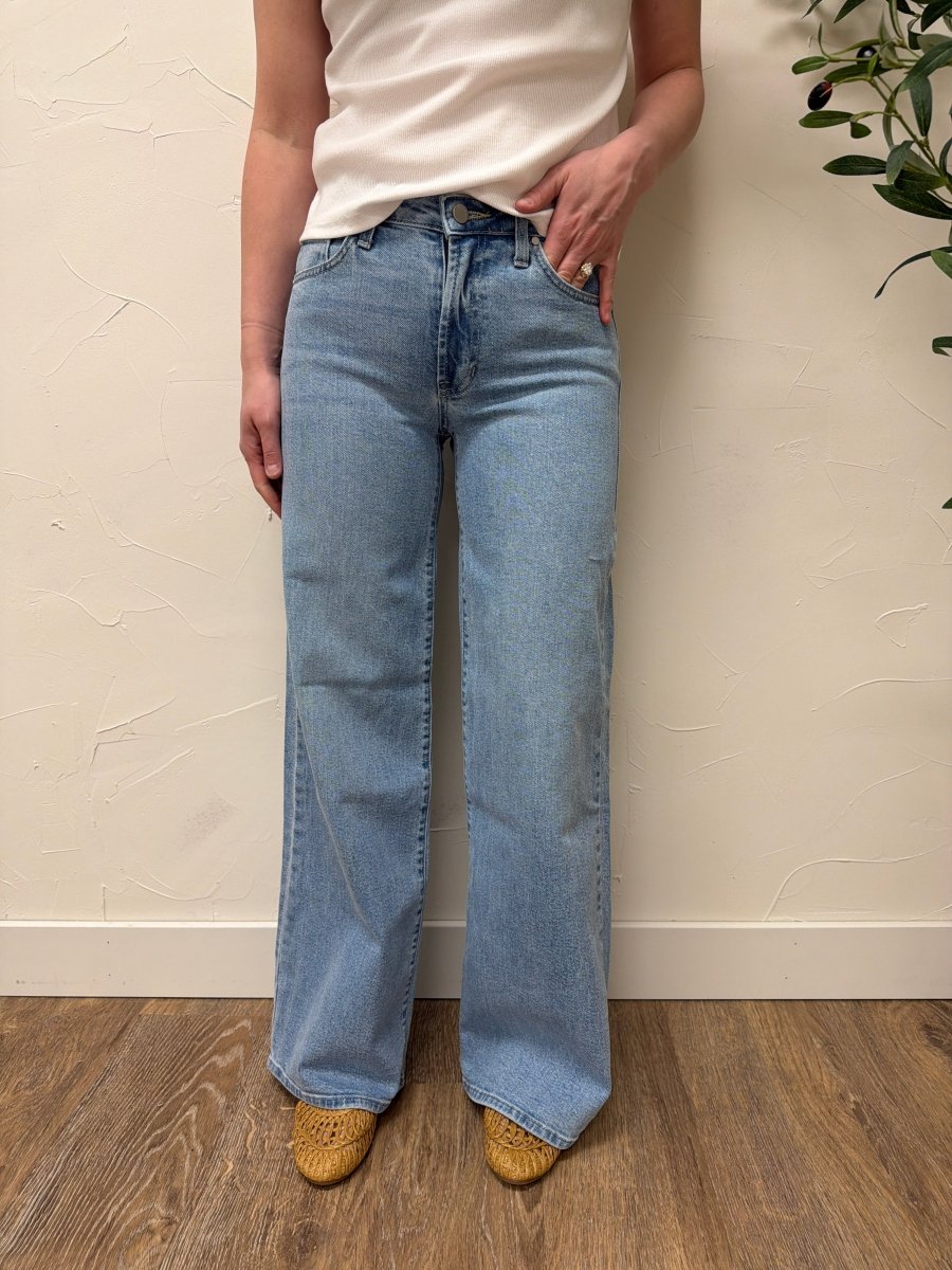 Lifestyle shot of model wearing Ultra Wide denim jeans styled with casual top — Three:Twelve Boutique