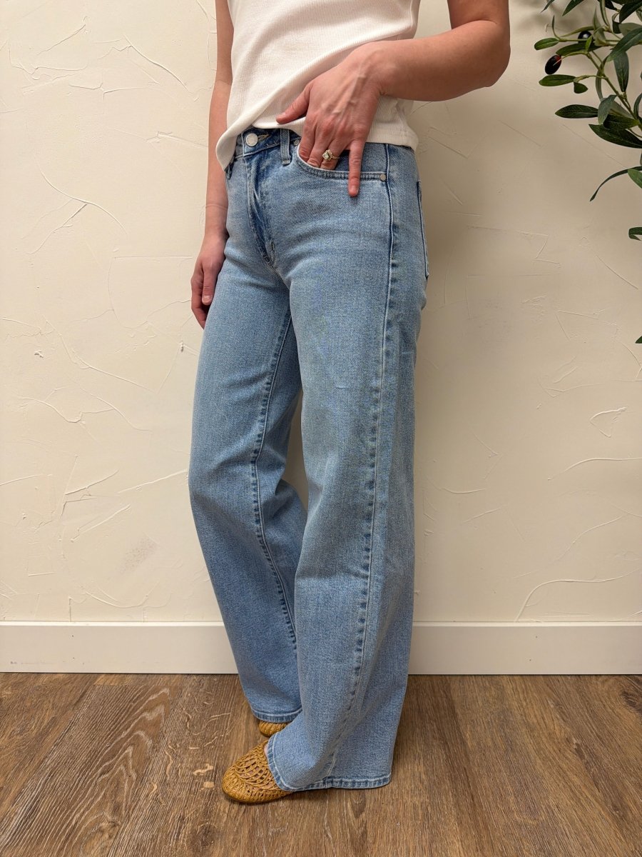 Lifestyle shot of model wearing Ultra Wide denim jeans styled with casual top — Three:Twelve Boutique