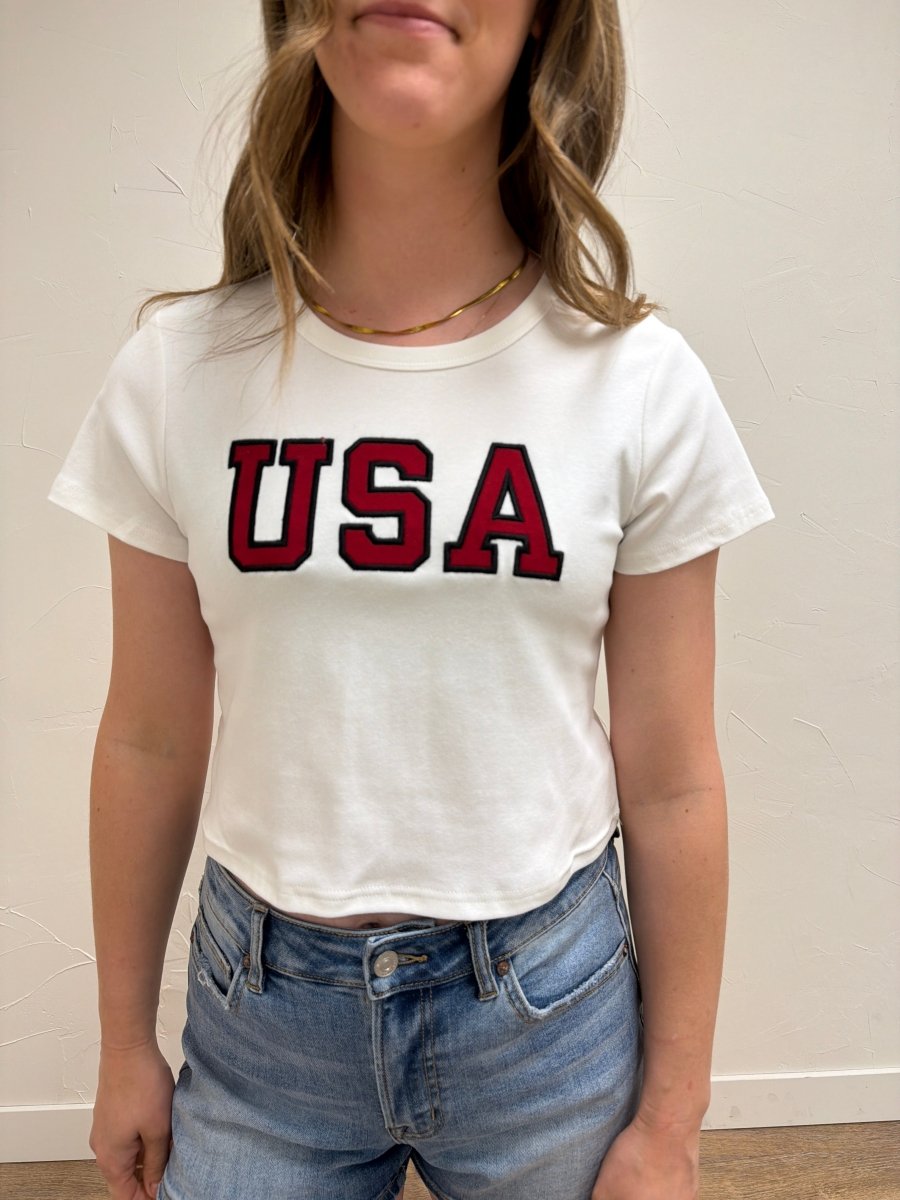 Close up of USA graphic detail on baby tee — Three Boutique