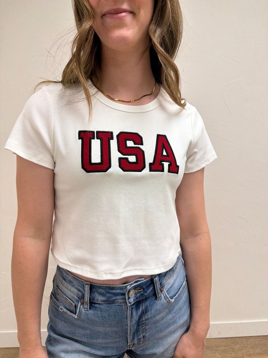 Close up of USA graphic detail on baby tee — Three Boutique