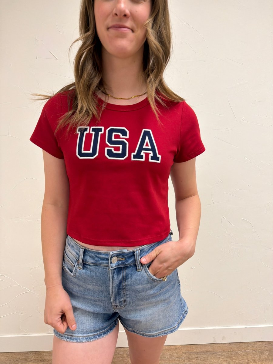 Close up of USA graphic detail on baby tee — Three Boutique
