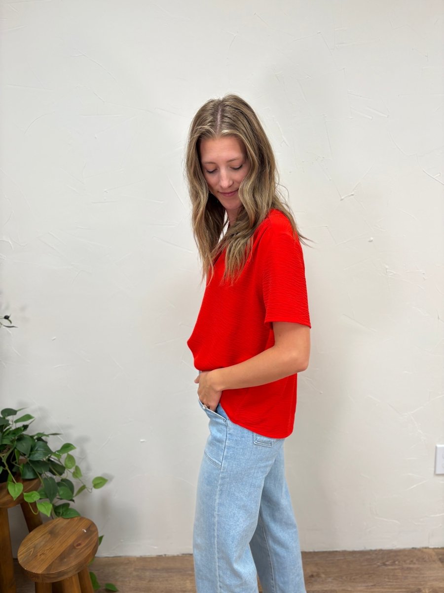 Side view of V neck dress shirt showing drape and fit — Three:Twelve Boutique