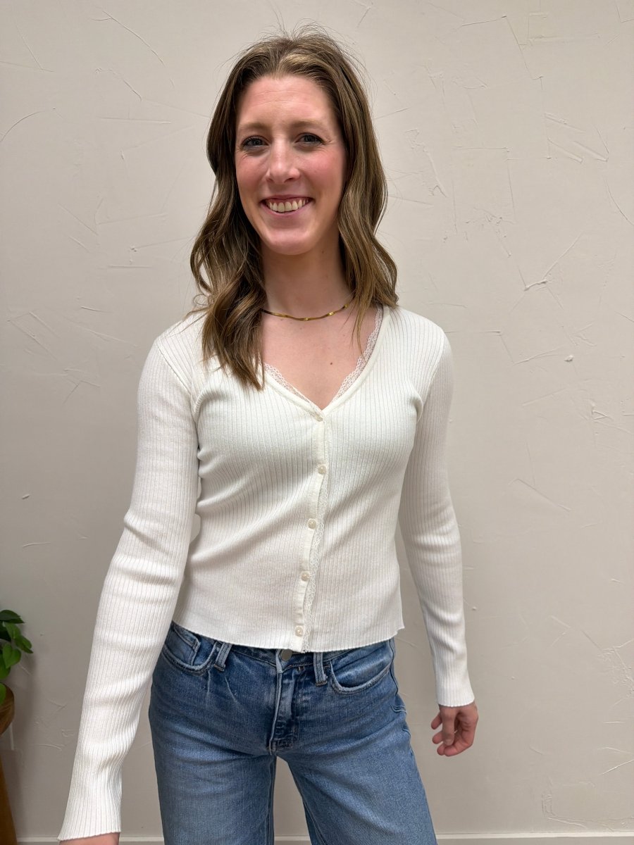 Front view of model wearing V-Neck long sleeve ribbed cardigan with button and lace details — Three:Twelve Boutique