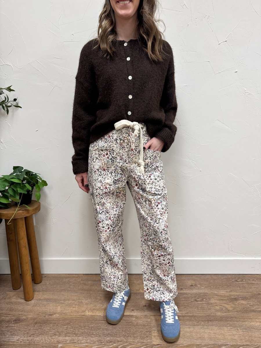Lifestyle shot of model wearing floral pull on pants styled casually — Three:Twelve Boutique