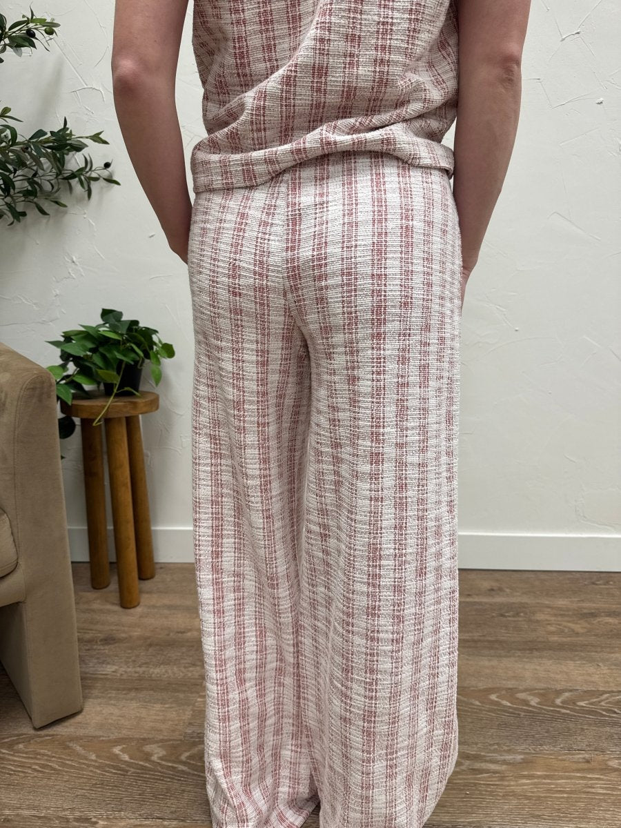 Back view of Zaria pants highlighting tailored waistband and straight-leg fit — Three:Twelve Boutique